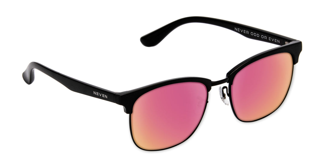 Three quarter view of Stealth prescription glasses showcasing a black TR90 frame and pink gradient lenses on white background