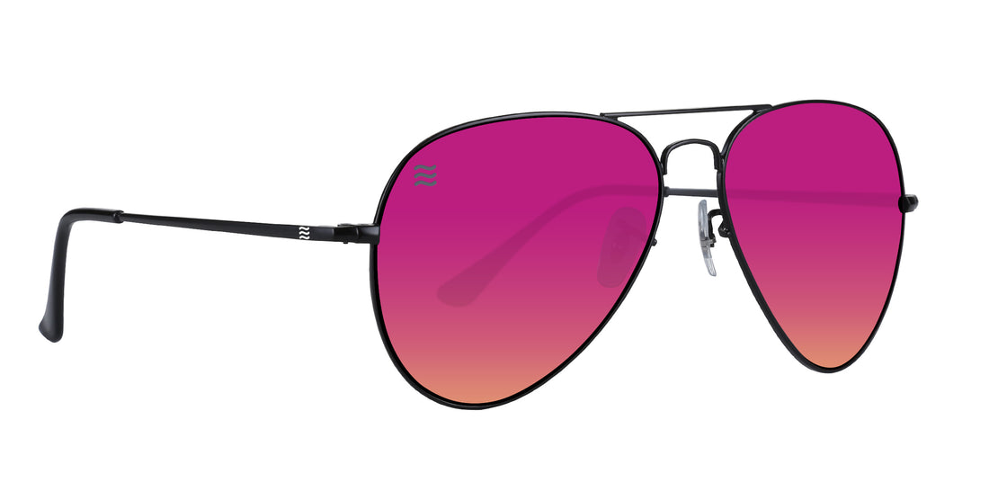 Three-quarter view of H2O Hudson aviator sunglasses with silver metal frame and purple-to-orange gradient lenses on white background