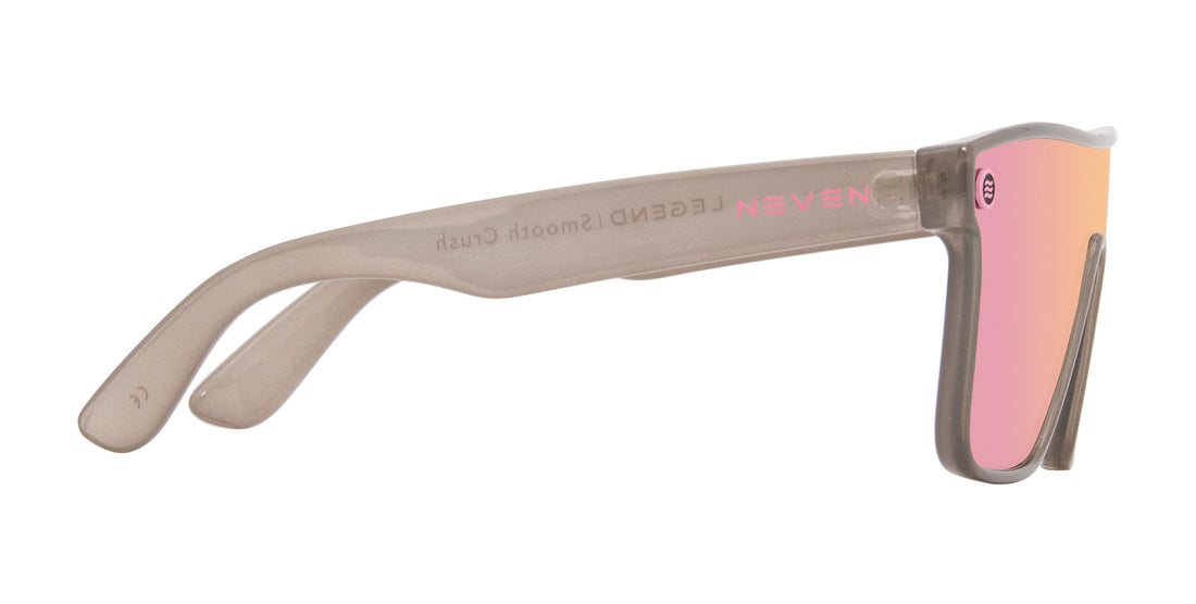 Side of Smooth Crush sunglasses showing transparent gray frame, pink champagne polarized lens and Neven logo