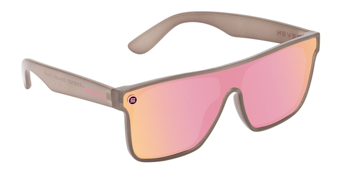 Angled view of Smooth Crush sunglasses showcasing transparent gray frame and pink champagne polarized uni lens on white background