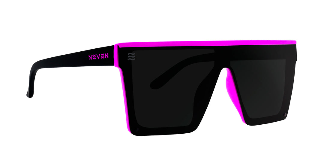Left close-up of Never Enough polarized sunglasses, black flat-top shield frame with pink trim and dark lenses