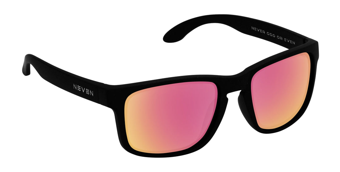 Angled close-up of Doom sunglasses showing matte black TR90 frame and pink mirrored prescription lenses on white background
