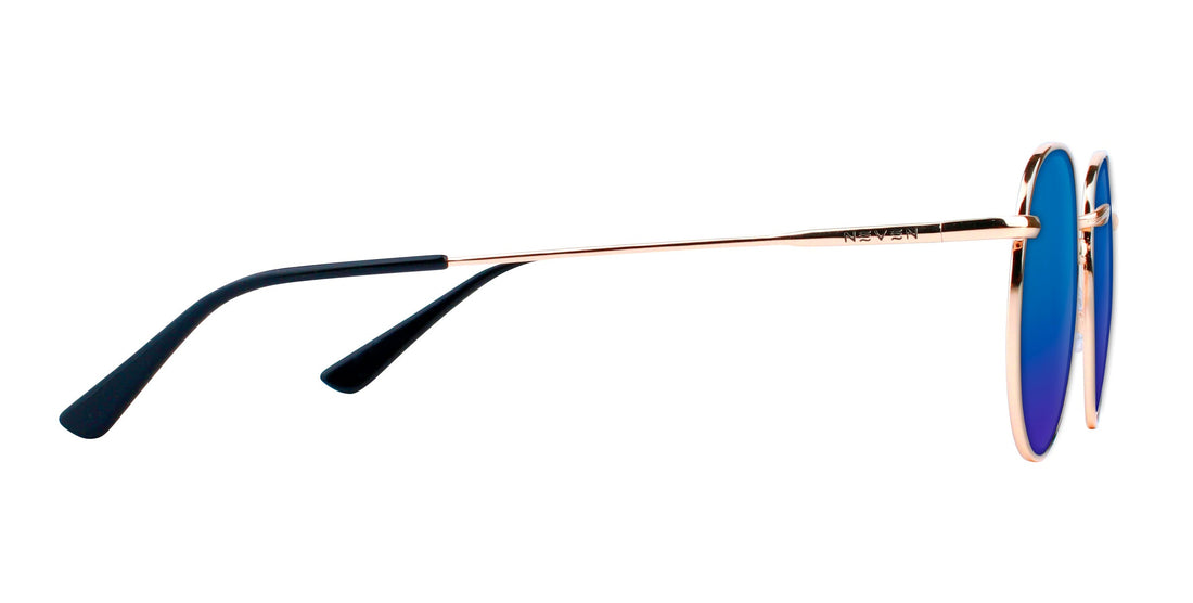 Side view of Rae prescription sunglasses showcasing blue lenses, gold frames, and black temple tips on white background