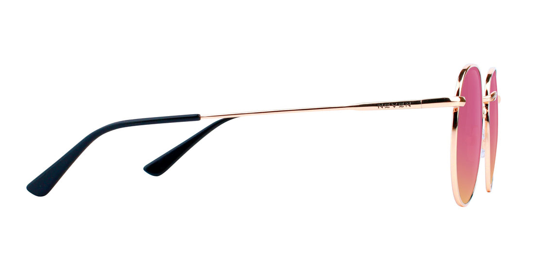 Side view of Rae prescription sunglasses showing thin gold temple with black tips and rose-pink lenses on white background