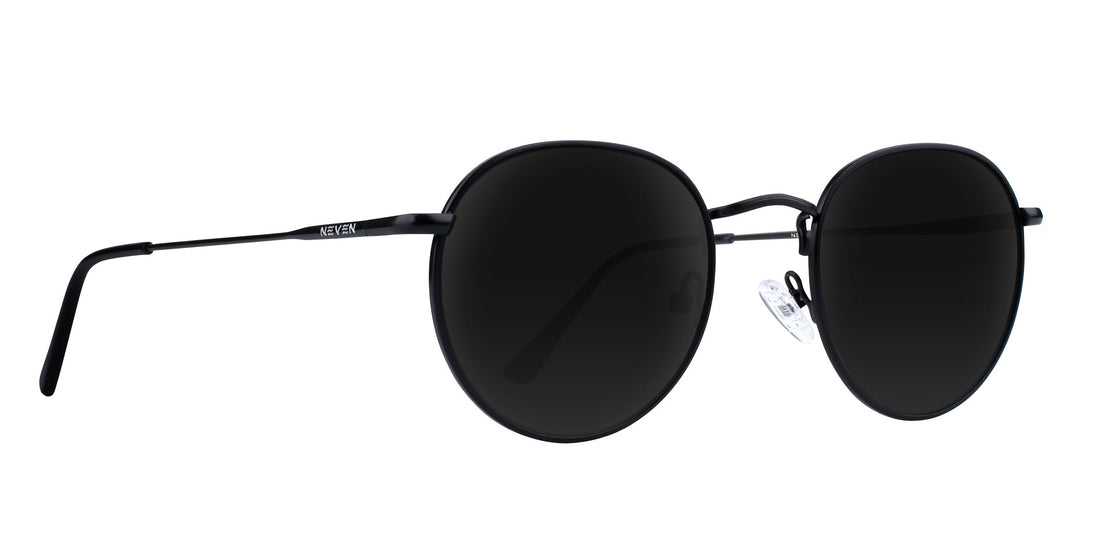Right close-up of Saint prescription aviator sunglasses with thin black metal frames and dark lenses on white background