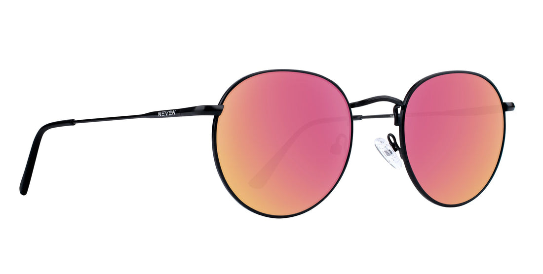 Close-up side view of Saint prescription aviator sunglasses showing thin black metal frame and rose-pink mirrored lenses on white background