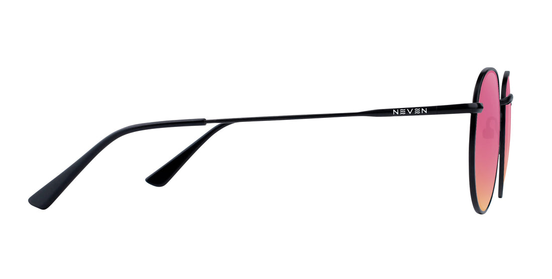 Side view of Saint prescription aviator sunglasses with thin black metal temples, Neven logo, and rose pink gradient lenses