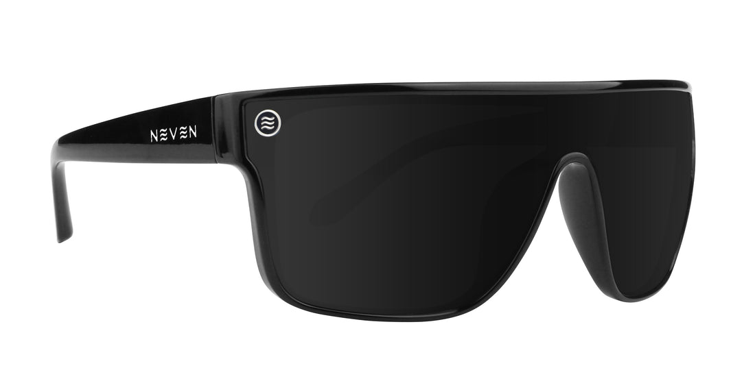 Front three-quarter view of Wire polarized sunglasses showcasing a glossy black shield lens and black frame on white background