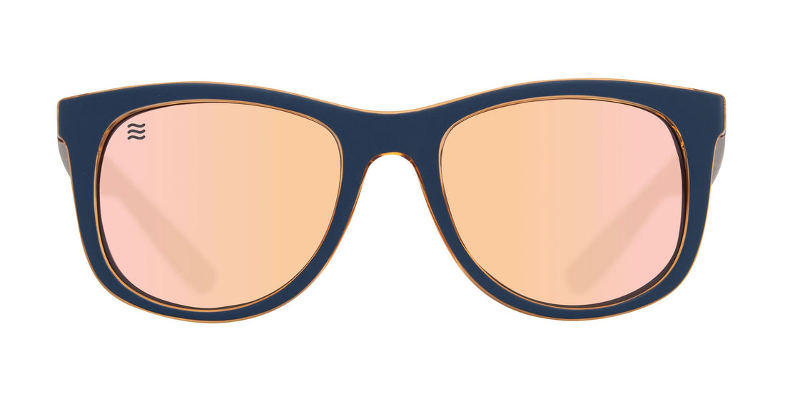 Front view of Sundown sunglasses showcasing navy matte cat-eye frame with champagne polarized lenses on white background