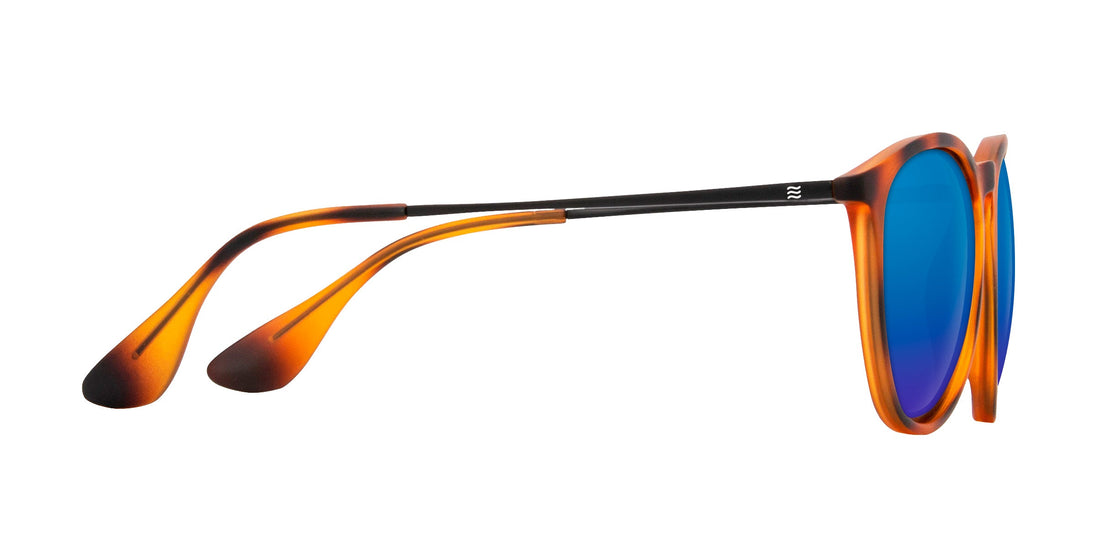 Side view of Bowie sunglasses showcasing tortoise shell frame, blue mirrored polarized lenses and slim black temples on white background