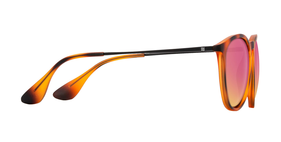Side view of Bowie prescription glasses showcasing tortoise frame, rose-pink lenses, and slim black temples on white background