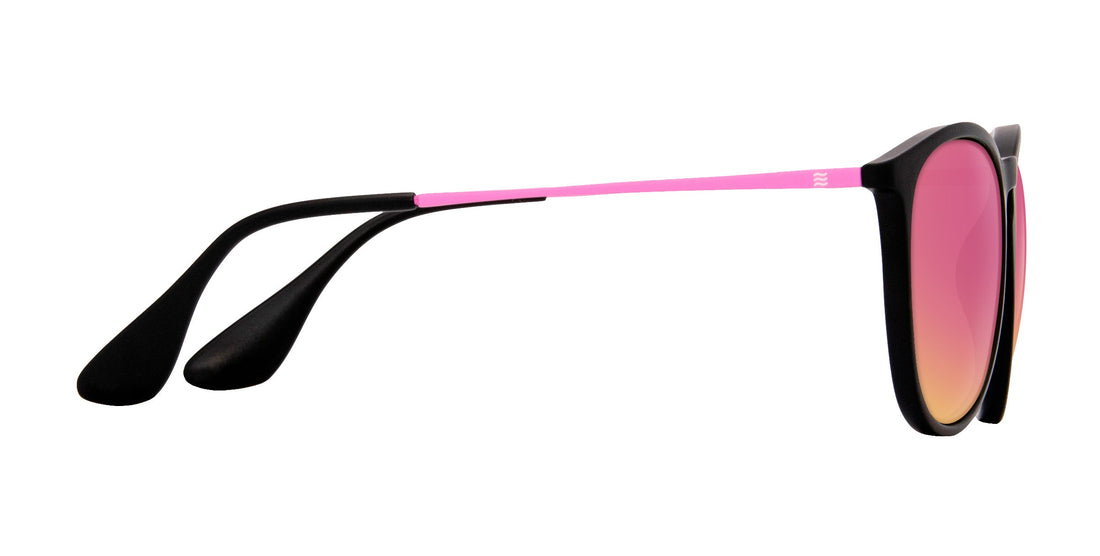 Side view of Quinn sunglasses (Rx) showing matte pink stainless-steel temples, black TR90 frame and mirrored rose-pink lenses on white background